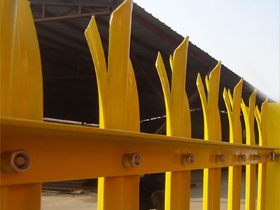 Yellow coated PVC palisade fence for factory, with W section pale and triple pointed head style.