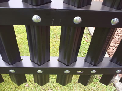 Two rails are fixed on the palisade pales and their surface is black PVC coated.