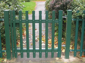 Green powder coated palisade gate with palisade fence as boundary of the park, the pales head type is rounded & notched.
